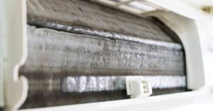 A close-up image of an air conditioner freezing up.